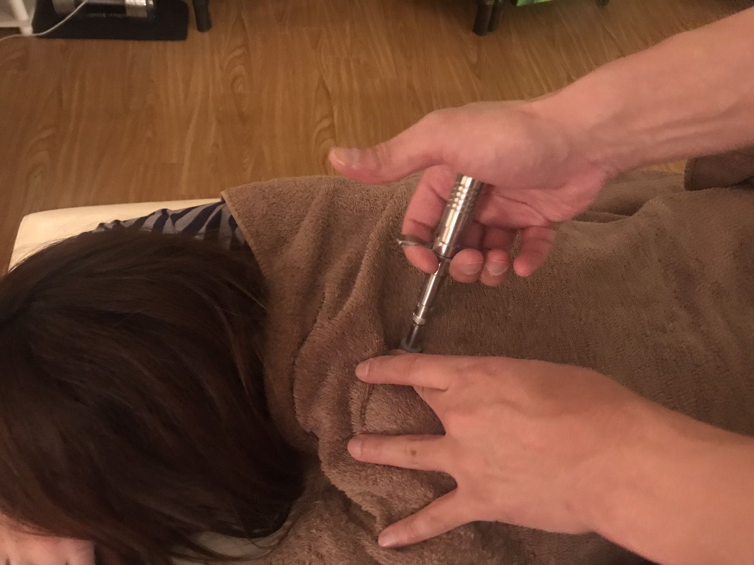 Demonstration of Activator use in cervical therapy